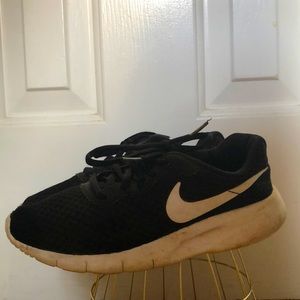 These are black Nike athletic shoes found in Great condition!